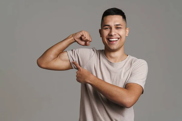 Brunette Happy Man Showing Pointing Finger His Bicep Isolated Grey — Stock Photo, Image