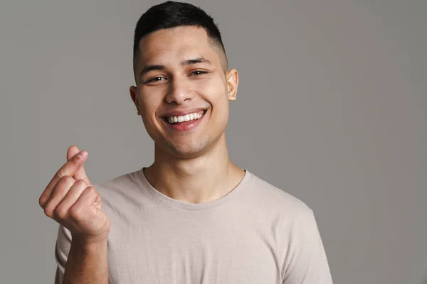 Brünette Glücklicher Mann Reibt Sich Die Finger Während Isoliert Über — Stockfoto