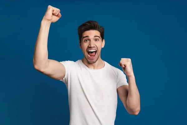 Excited Unshaven Guy Screaming Making Winner Gesture Isolated Blue Background — Stock Photo, Image