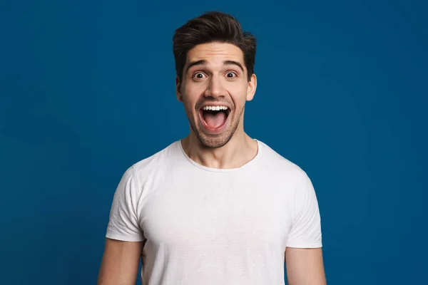 Excited Unshaven Guy Expressing Surprise Camera Isolated Blue Background — Stock Photo, Image