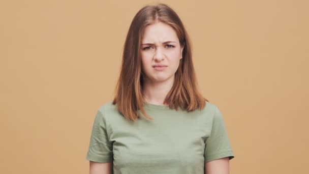 Displeased Young Woman Doing Thumb Gesture Standing Isolated Beige Wall — Stock Video