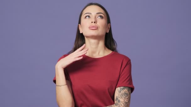 Serious Confident Young Woman Looking Camera Standing Isolated Purple Background — Stock Video