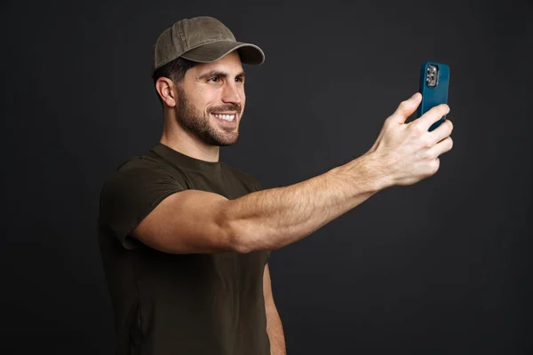 Happy Military Man Smiling While Taking Selfie Cellphone Isolated Black — 스톡 사진
