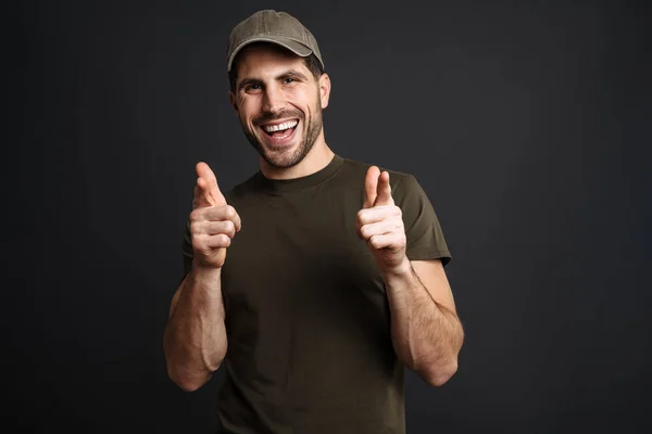 Joyful Masculine Military Man Smiling Pointing Fingers Camera Isolated Black — Stock Photo, Image