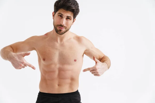 Shirtless Pleased Sportsman Pointing Fingers His Abs Isolated White Background — 스톡 사진