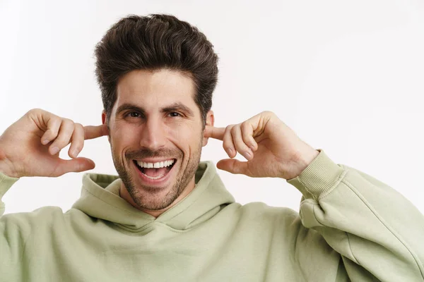 Cheerful Handsome Man Sportswear Plugging His Ears Isolated White Background — Stock Photo, Image