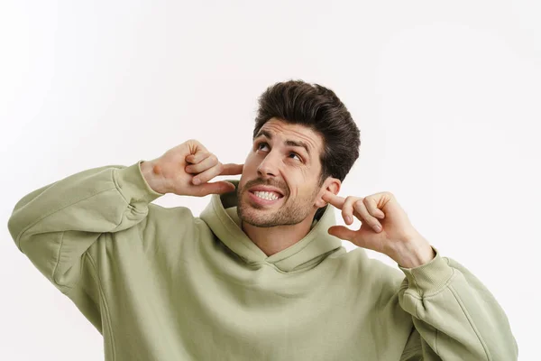 Displeased Handsome Man Sportswear Plugging His Ears Isolated White Background — Stock Photo, Image