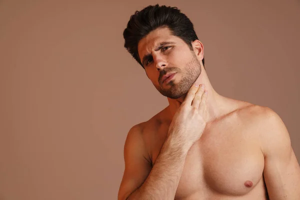 Brooding Half Naked Man Looking Camera Rubbing His Neck Isolated — Stock Photo, Image