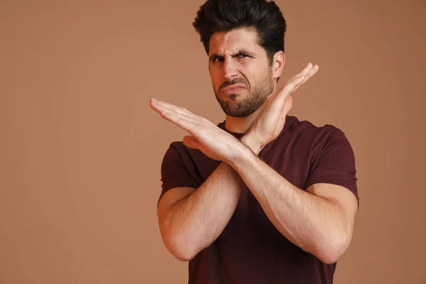 Displeased Unshaven Young Man Showing Stop Gesture Camera Isolated Beige — Stock Photo, Image