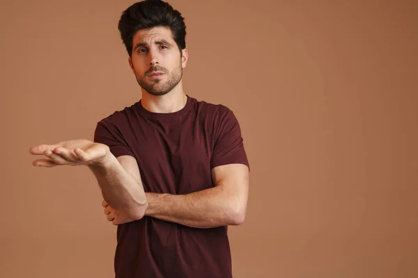 Confused Masculine Man Gesturing Looking Camera Isolated Beige Background — Stock Photo, Image