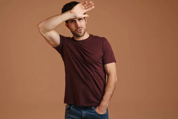 Displeased Young Man Headache Touching His Forehead Isolated Beige Background — Stock Photo, Image