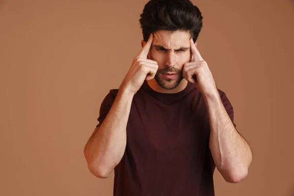 Displeased Young Man Headache Rubbing His Temples Isolated Beige Background — Stock Photo, Image