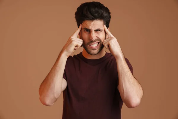 Displeased Young Man Headache Rubbing His Temples Isolated Beige Background — Stock Photo, Image