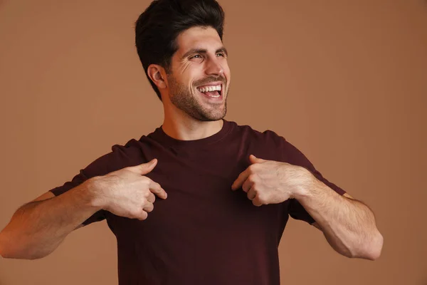 Happy Masculine Young Man Smiling Pointing Fingers Himself Isolated Beige — Stock Photo, Image