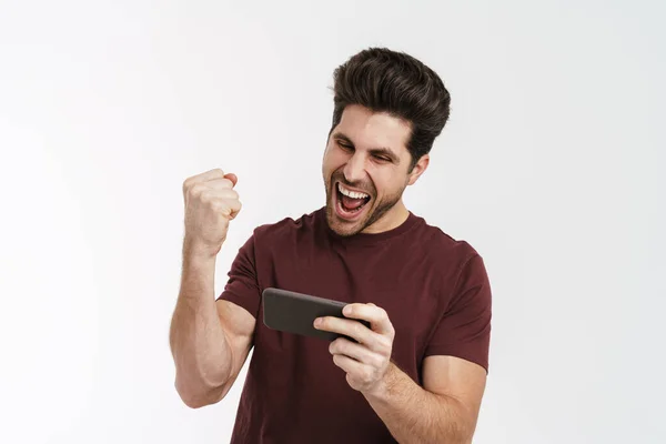 Hombre Excitado Haciendo Gesto Ganador Mientras Juega Juego Línea Teléfono — Foto de Stock