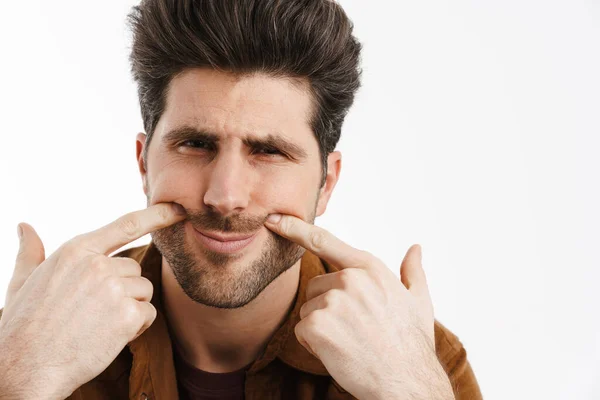 Infelice Giovane Uomo Unshaven Puntare Dito Contro Guance Isolato Sfondo — Foto Stock