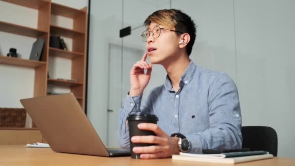 Positive Chinese Man Talking Headphones Nodding His Head Positively While — Stock video