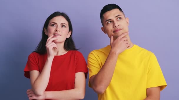 Brooding Couple Thinking Something Having Idea While Standing Purple Studio — Stock Video