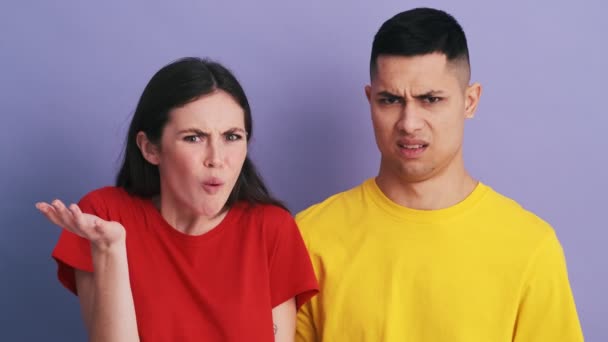 Negatively Surprised Couple Looking Each Other Saying What While Standing — Stock video