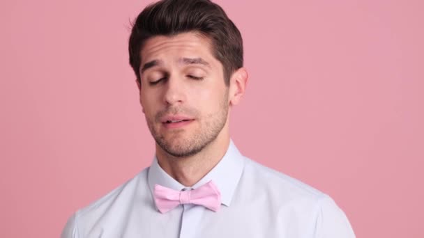 Upset Young Man Wearing Bow Tie Standing Isolated Pink Wall — 비디오