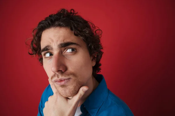 Brooding Handsome Man Thinking Looking Aside Isolated Red Background — Stock Photo, Image