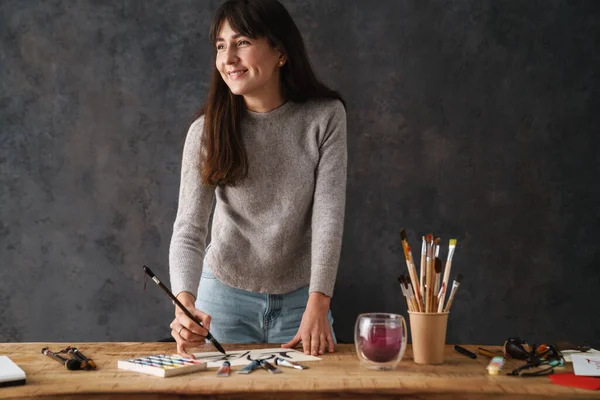 Smiling Beautiful Calligrapher Girl Writing Brush While Working Table Indoors — Stock Photo, Image