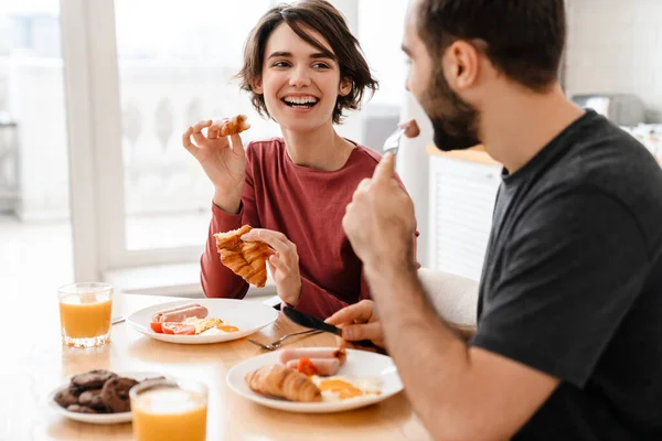 Cheerful Attractive Young Couple Having Tasty Breakfast Kitchen Table — Stock Photo, Image