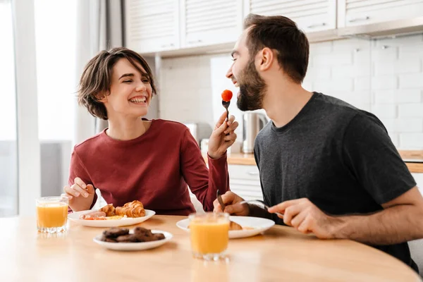 Happy Beautiful Couple Smiling While Having Breakfast Home — Stock Photo, Image