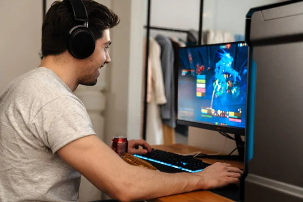 Happy Brunette Guy Headphones Playing Video Game His Computer While — Stock Photo, Image