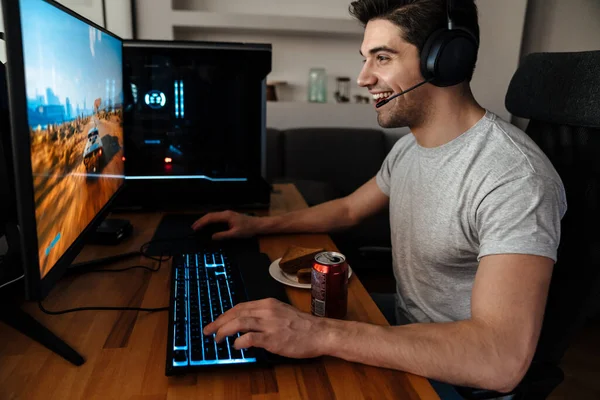 Happy Brunette Guy Headphones Playing Video Game His Computer While — Stock Photo, Image