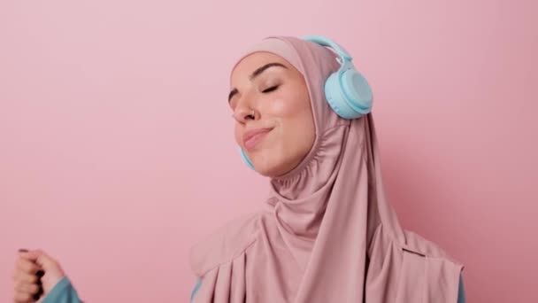 Pleased Relaxed Arabian Woman Closed Eyes Listening Music Using Headphones — Stock Video