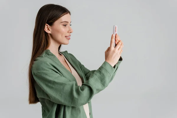 Happy Caucasian Girl Smiling Taking Photo Mobile Phone Isolated White — Stock Photo, Image