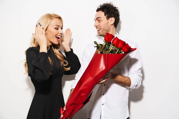 Happy Man Smiling Giving Red Roses His Excited Girlfriend Isolated — Stock Photo, Image