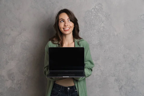 Happy Beautiful Nice Girl Smiling Showing Laptop Isolated Grey Wall — Stock Photo, Image