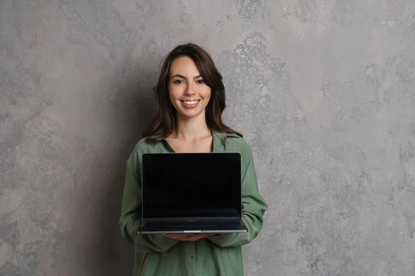 Happy Beautiful Nice Girl Smiling Showing Laptop Isolated Grey Wall — Stock Photo, Image