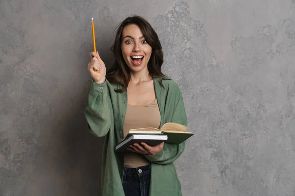 Excited Nice Girl Exclaiming While Writing Notes Exercise Book Isolated — Stock Photo, Image