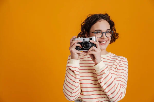 Cheerful Young Woman Taking Photos Camera Isolated Yellow Background — Stockfoto
