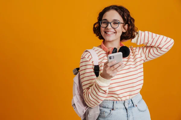 Cheerful Young Girl Backpack Using Mobile Phone While Standing Isolated — Stock Photo, Image