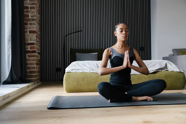 Calm African American Girl Meditating While Doing Yoga Practice Home — Stockfoto