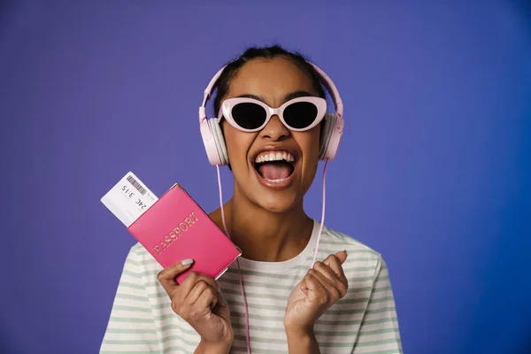 Excited Black Woman Headphones Holding Passport Ticket Isolated Blue Background — 图库照片