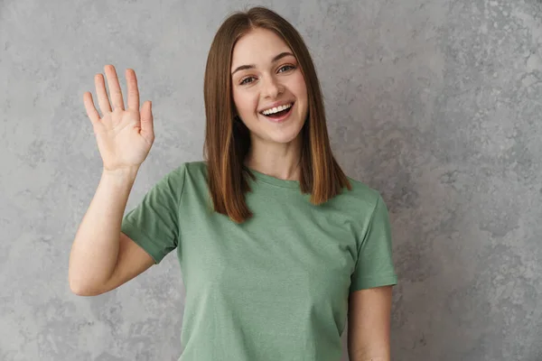 Happy Blonde Young Woman Waving Gray Wall Greeting Gesture — 스톡 사진