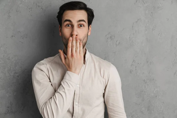 Excited Handsome Guy Covering His Mouth Looking Camera Isolated Grey — Stock Photo, Image