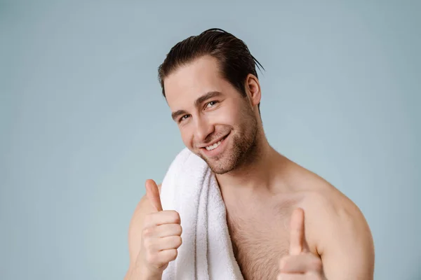 Happy Brunette Bearded Shirtless Man Towel Blue Wall Giving Thumbs — ストック写真