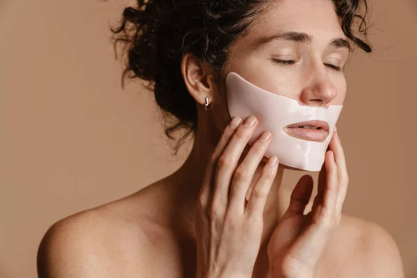 Half Naked European Woman Posing Cosmetic Facial Mask Isolated Beige — ストック写真