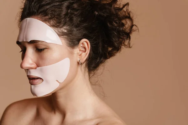 Half Naked European Woman Posing Cosmetic Facial Mask Isolated Beige — ストック写真