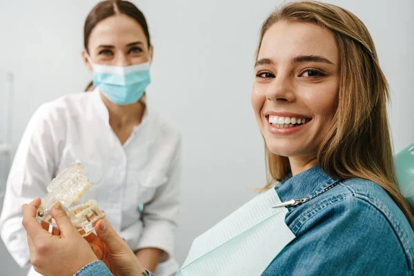 European Mid Happy Dentist Woman Showing Teeth Imitation Her Patient — Stock Photo, Image