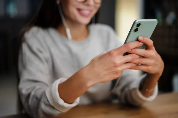 Happy Young Woman Listening Music Earphones Mobile Phone While Sitting — Stock Photo, Image