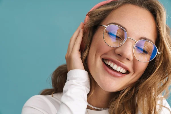 Smiling Young Blonde Woman Glasses Listening Music Wireless Headphones Blue — 图库照片