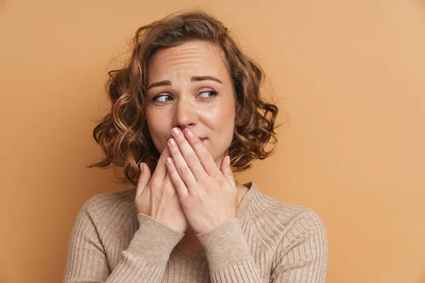 Young Ginger Woman Looking Aside While Covering Her Mouth Isolated — 图库照片