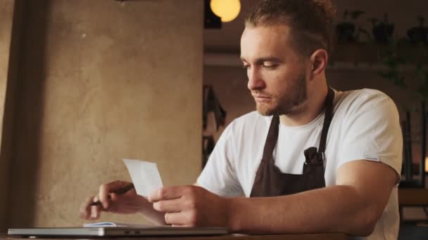 Serious White Cafe Worker Working Receipt While Sitting Table Cafe — Stock Video